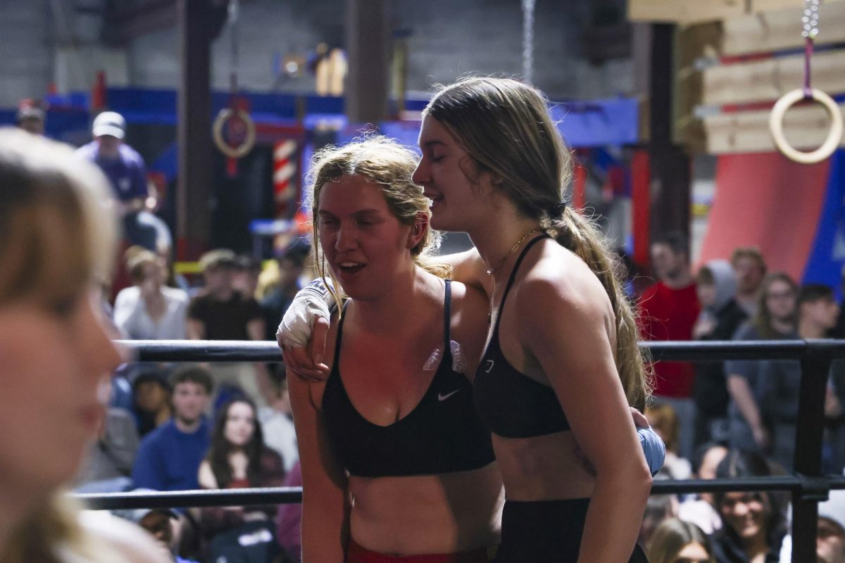 Danielle Eisemann and Emi Arzola embrace after their match during the UK Boxing club exhibition match on Friday, April 12, 2024, at Thrive Tribe Boxing club in Lexington, Kentucky. Photo by Matthew Mueller | Staff