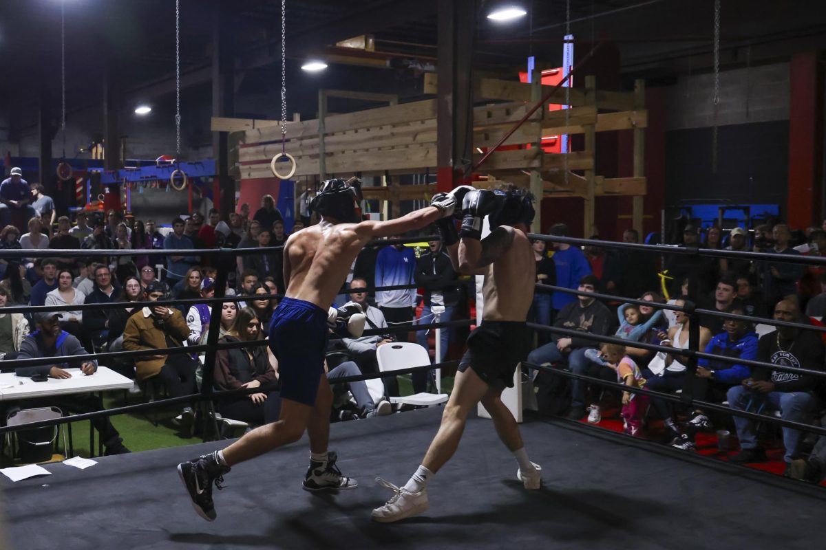 Anton Ffiske lands a punch on Trent Breuer during the UK Boxing club exhibition match on Friday, April 12, 2024, at Thrive Tribe Boxing club in Lexington, Kentucky. Photo by Matthew Mueller | Staff
