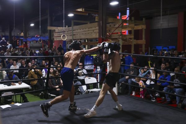 Anton Ffiske lands a punch on Trent Breuer during the UK Boxing club exhibition match on Friday, April 12, 2024, at Thrive Tribe Boxing club in Lexington, Kentucky. Photo by Matthew Mueller | Staff