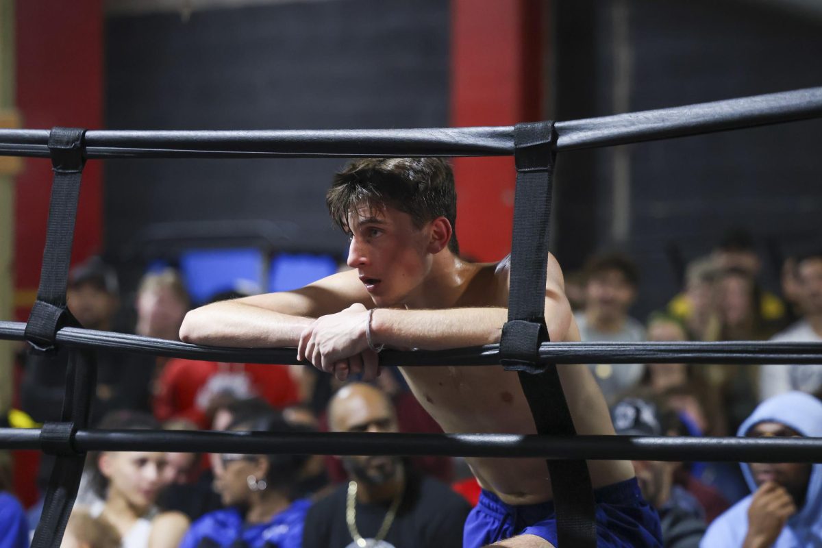 Anton Ffiske watches the next match after his during the UK Boxing club exhibition match on Friday, April 12, 2024, at Thrive Tribe Boxing club in Lexington, Kentucky. Photo by Matthew Mueller | Staff