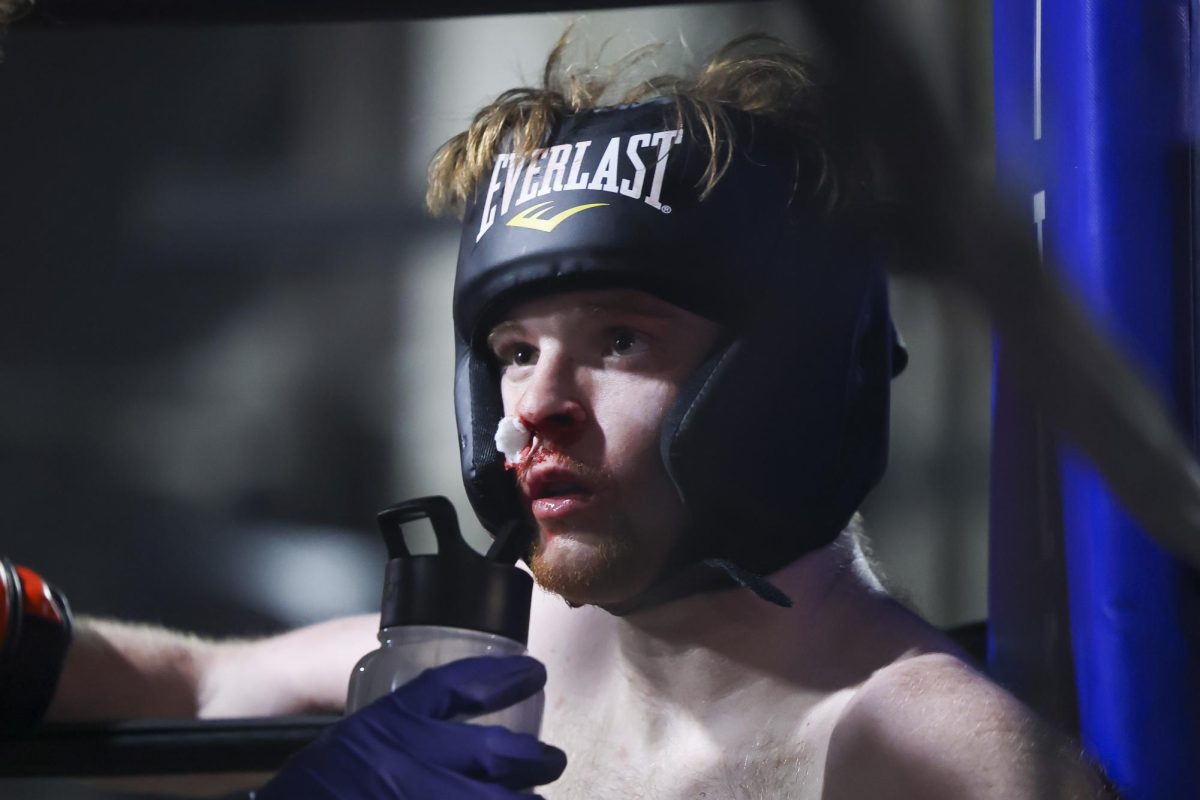 Hunter Williams sits in his corner during the UK Boxing club exhibition match on Friday, April 12, 2024, at Thrive Tribe Boxing club in Lexington, Kentucky. Photo by Matthew Mueller | Staff