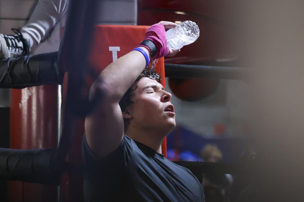 Logan Sheehan pours water on his head after his match during the UK Boxing club exhibition match on Friday, April 12, 2024, at Thrive Tribe Boxing club in Lexington, Kentucky. Photo by Matthew Mueller | Staff