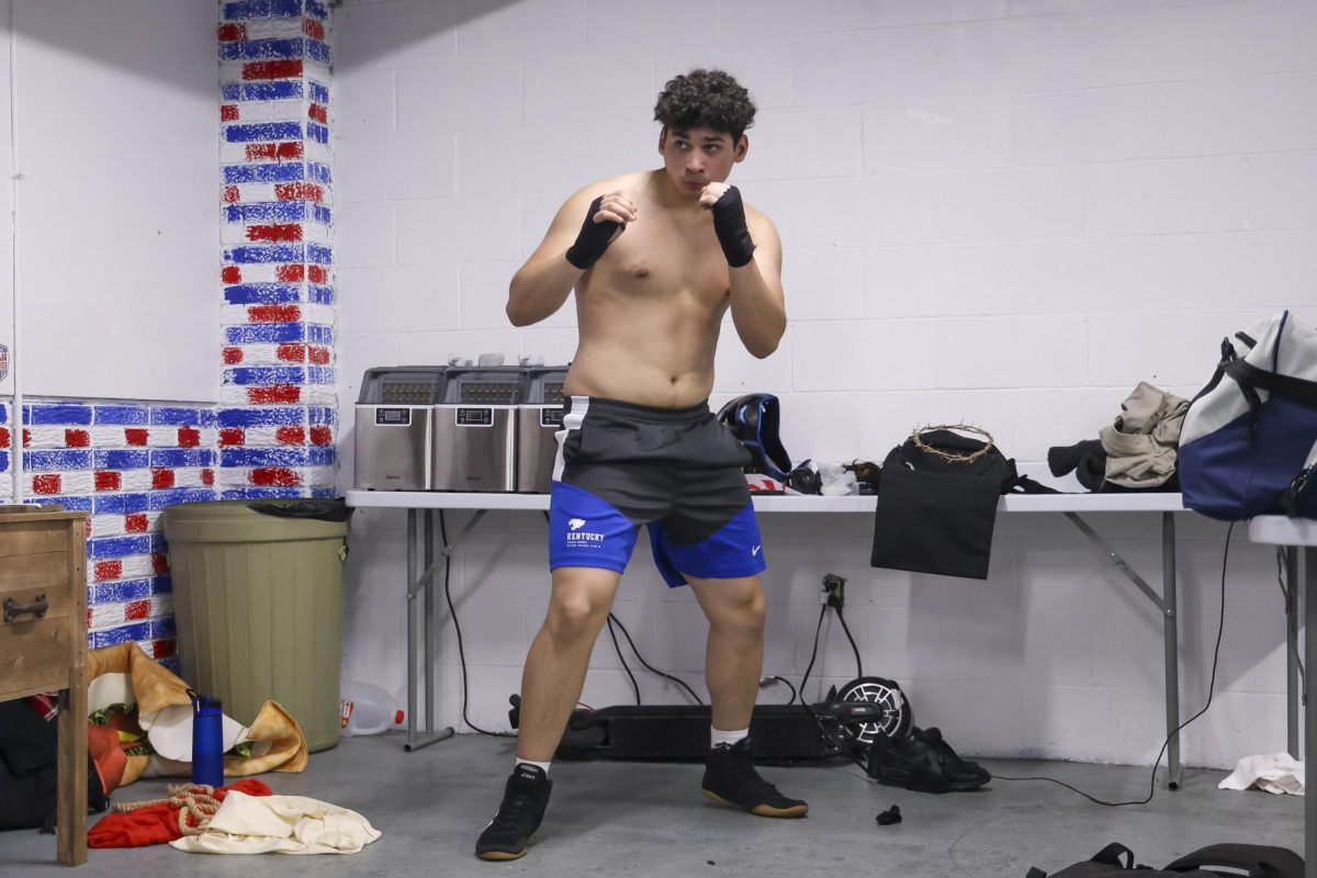 Brayden Sosa, 19, warms up before his match during the UK Boxing club exhibition match on Friday, April 12, 2024, at Thrive Tribe Boxing club in Lexington, Kentucky. Photo by Matthew Mueller | Staff
