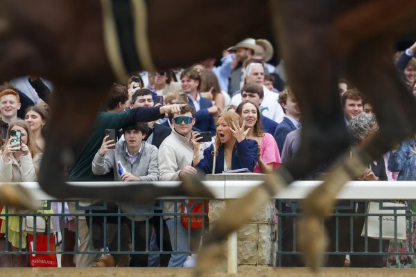 Students react to winners of the third race on Friday, April 19, 2024, at Keeneland During College day in Lexington, Kentucky. Photo by Matthew Mueller | Staff