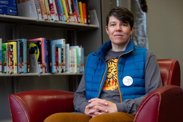 Author-Illustrator Rachel Elliot sits in front of the graphic novel section of the Lucille Caudill Little Fine Arts Library on Tuesday, April 9, 2024, at the University of Kentucky in Lexington, Kentucky. Photo by Christian Kantosky | Staff