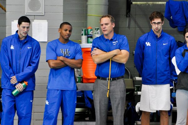 Head coach Lars Jorgensen talks to assistant coaches during the UK Swimming and Diving meet against The Ohio State University on Friday, October 11, 2013, at the Lancaster Aquatic Center in Lexington, Kentucky. Photo by Jonathan Krueger | Staff