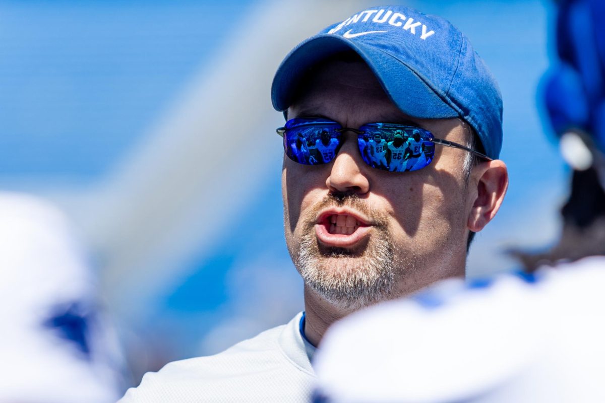 Kentucky defensive coordinator Brad White speaks with players before the Kentucky Blue-White Spring football game on Saturday, April 13, 2024, at Kroger Field in Lexington, Kentucky. Photo by Samuel Colmar | Staff