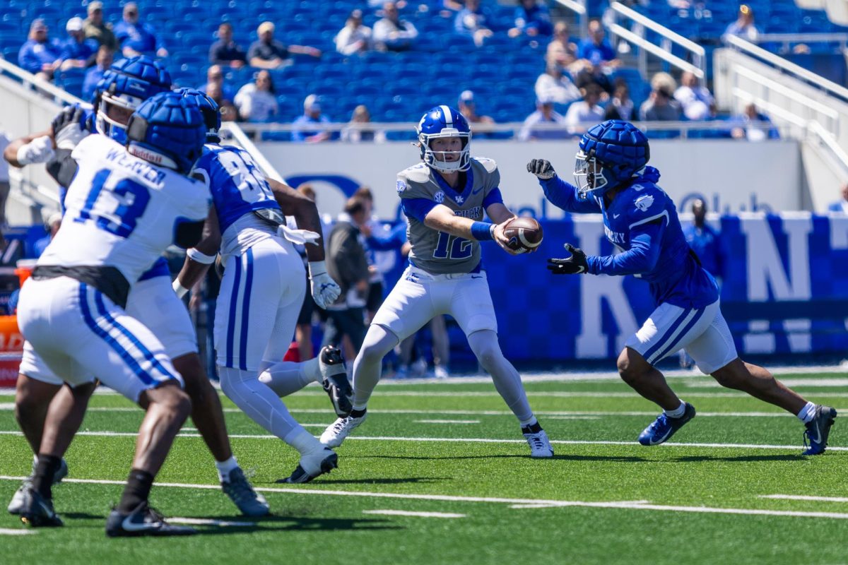 Kentucky quarterback Brock Vandagriff (12) hands the ball off during the Kentucky Blue-White Spring football game on Saturday, April 13, 2024, at Kroger Field in Lexington, Kentucky. Photo by Samuel Colmar | Staff