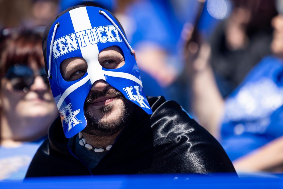 A fan wears a Kentucky mask during the Kentucky Blue-White Spring football game on Saturday, April 13, 2024, at Kroger Field in Lexington, Kentucky. Photo by Samuel Colmar | Staff