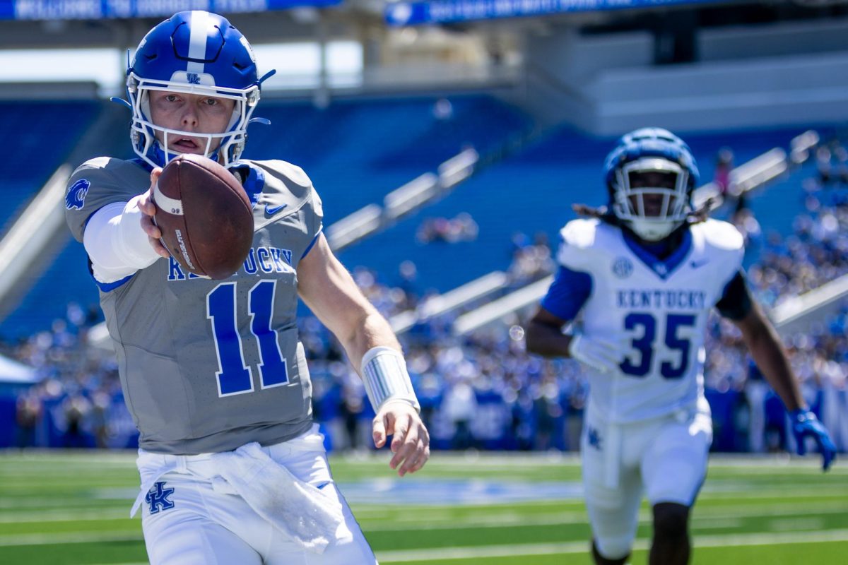 Kentucky quarterback Beau Allen (11) holds the ball out as he runs out-of-bounds during the Kentucky Blue-White Spring football game on Saturday, April 13, 2024, at Kroger Field in Lexington, Kentucky. Photo by Samuel Colmar | Staff