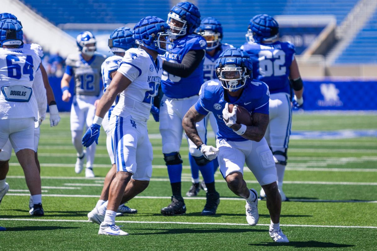 Kentucky running back DeaMontae Trayanum (4) runs with the ball during the Kentucky Blue-White Spring football game on Saturday, April 13, 2024, at Kroger Field in Lexington, Kentucky. Photo by Samuel Colmar | Staff