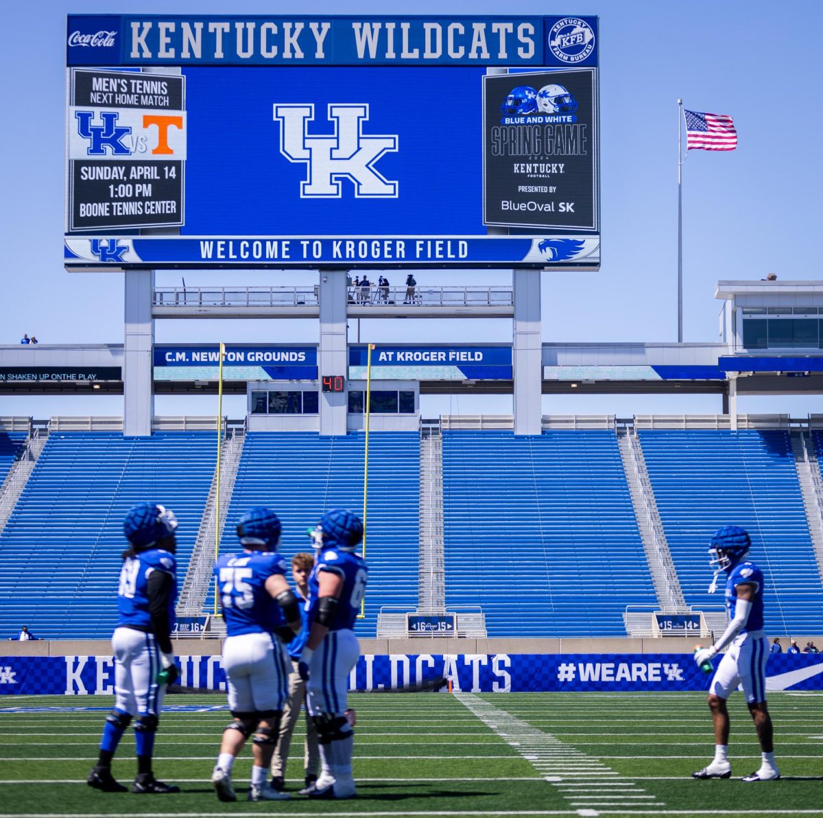 Kentucky players talk between snaps during the Kentucky Blue-White Spring football game on Saturday, April 13, 2024, at Kroger Field in Lexington, Kentucky. Photo by Samuel Colmar | Staff