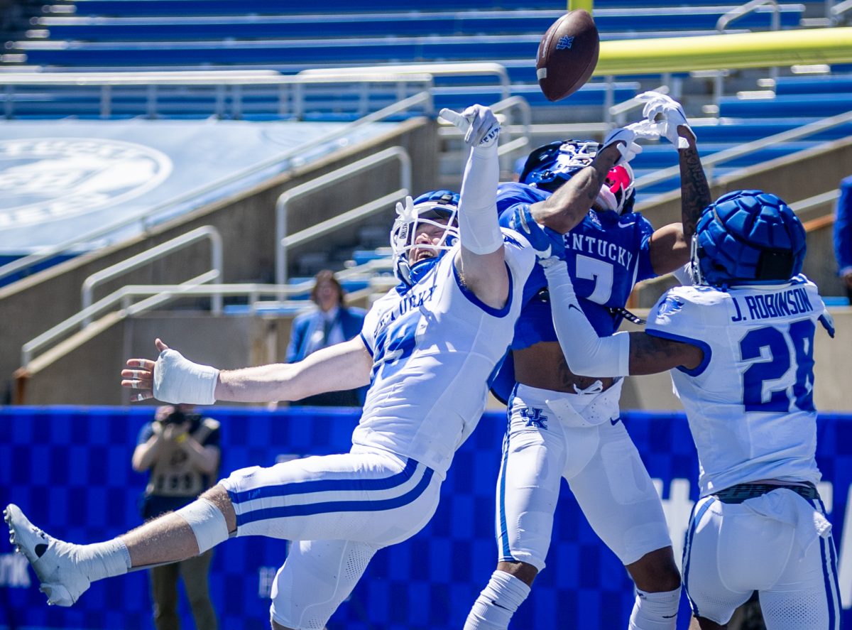Kentucky players jump for the ball during the Kentucky Blue-White Spring football game on Saturday, April 13, 2024, at Kroger Field in Lexington, Kentucky. Photo by Samuel Colmar | Staff