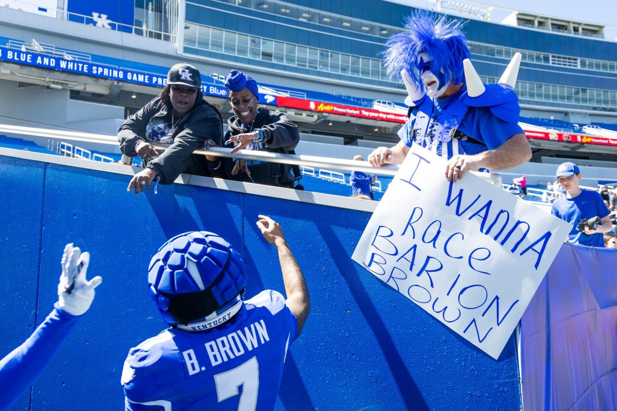 Kentucky wide receiver Barion Brown (7) greets fans before the Kentucky Blue-White Spring football game on Saturday, April 13, 2024, at Kroger Field in Lexington, Kentucky. Photo by Samuel Colmar | Staff