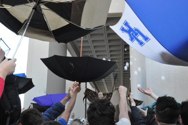 Students try to catch as many ping pong balls as possible as they fall from Patterson Office Tower at the University of Kentucky in Lexington, KY on April 22, 2024. Photo by Isabella Sepahban | Staff
