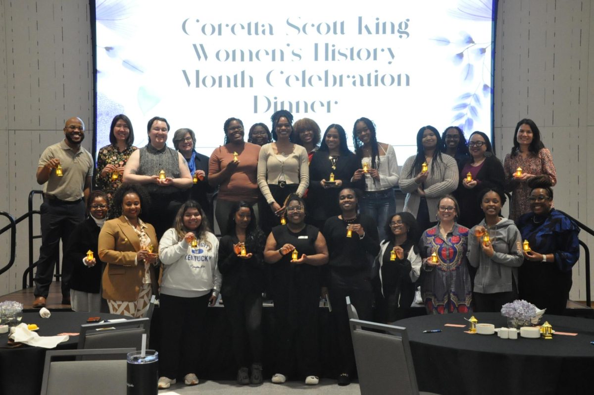 Guest pose for a group photo holding lanterns following a lantern-lighting ceremony for the Coretta Scott King Celebration Dinner in the Gatton Student Center at the University of Kentucky in Lexington, Kentucky, on March 26, 2024. Photo by Isabella Sepahban | Staff