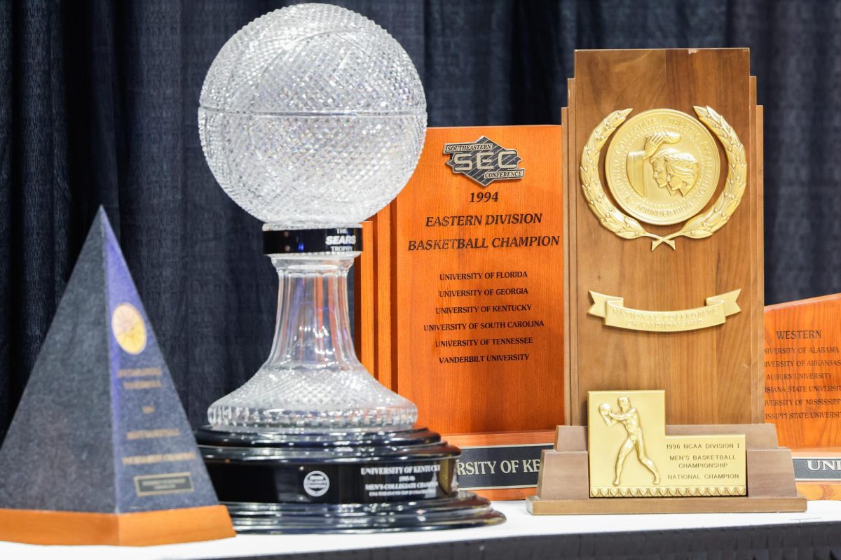 National Championship trophies sit on a table at Mark Pope’s introductory press conference as the new head coach of Kentucky men’s basketball on Sunday, April 14, 2024, at Rupp Arena in Lexington, Kentucky. Photo by Abbey Cutrer | Staff