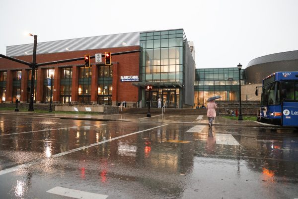 A student walks across the street in the rain on Tuesday, April 2, 2024, at the University of Kentucky in Lexington, Kentucky. Photo by Abbey Cutrer | Staff