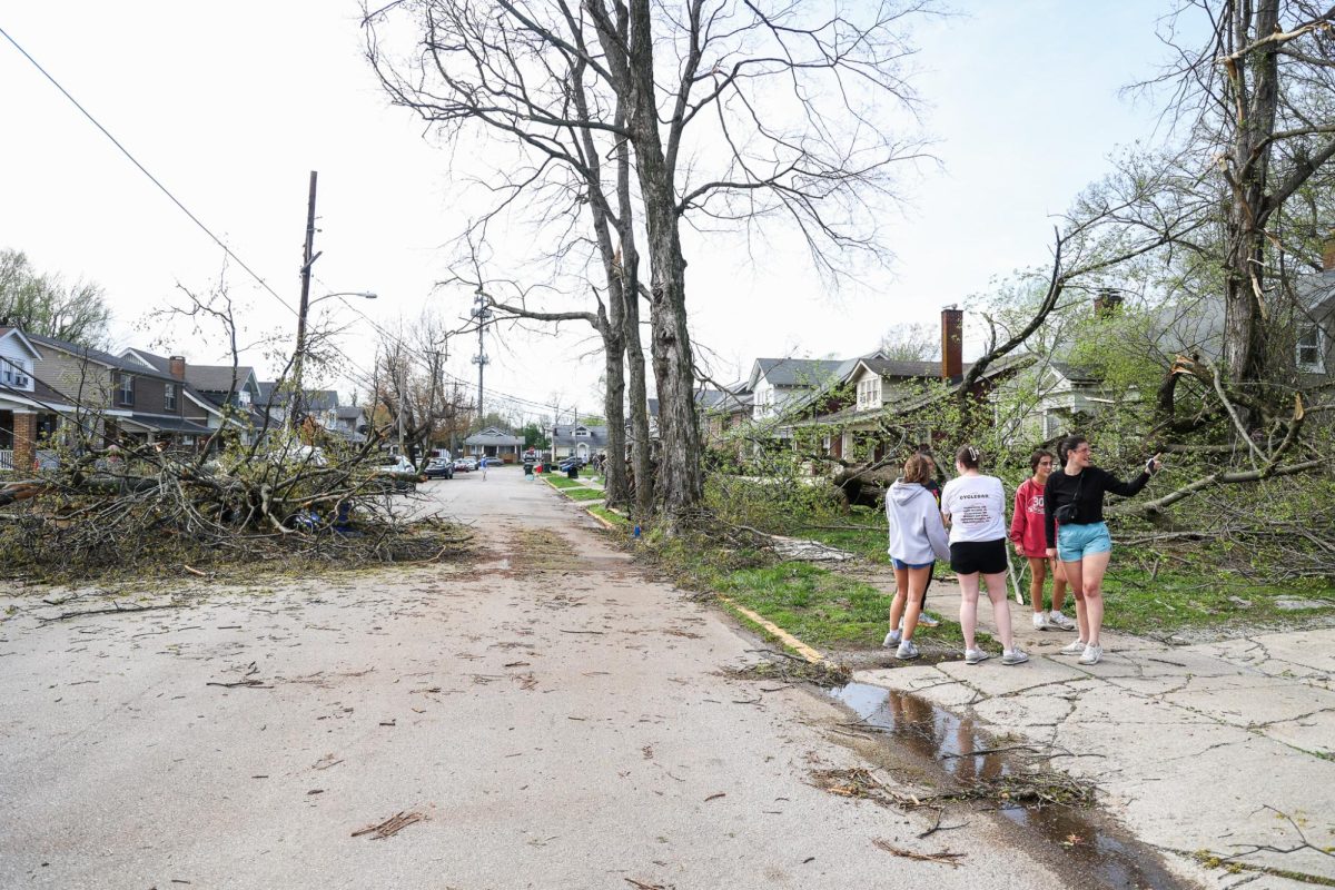 A group of UK students look at the wreckage after severe weather on Tuesday, April 2, 2024, on University Avenue in Lexington, Kentucky. Photo by Abbey Cutrer | Staff