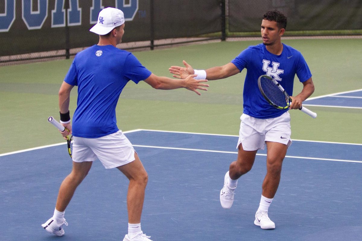Fifth-Year Taha Baadi celebrates with freshman Jack Loutit after they win a point in doubles at the Hillary J. Boone Tennis Facility on Friday, May 3, 2024, in Lexington, Kentucky.