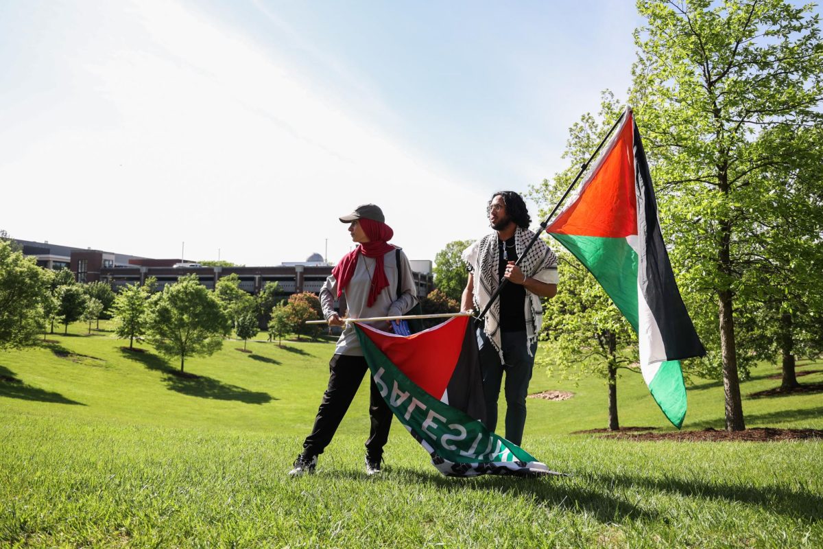 Ala Hassan and Kareem Hassan hold Palestinian flags during a solidarity rally for Gaza on Wednesday, May 1, 2024, outside of the William T. Young Library at the University of Kentucky in Lexington, Kentucky. Photo by Abbey Cutrer | Staff