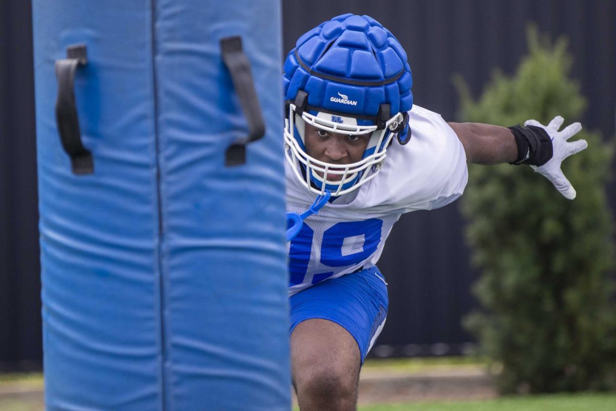 Defensive Lineman Kendrick Gilbert practices defensive drills during Kentucky Football’s media day on Friday, Aug. 2, 2024, at Kroger Field in Lexington, Kentucky. Photo by Matthew Mueller | Photo Editor