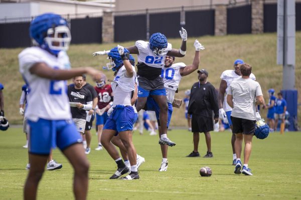 Kentucky’s defensive team celebrates after getting a stop during Kentucky Football’s media day on Friday, Aug. 2, 2024, at Kroger Field in Lexington, Kentucky. Photo by Matthew Mueller | Photo Editor