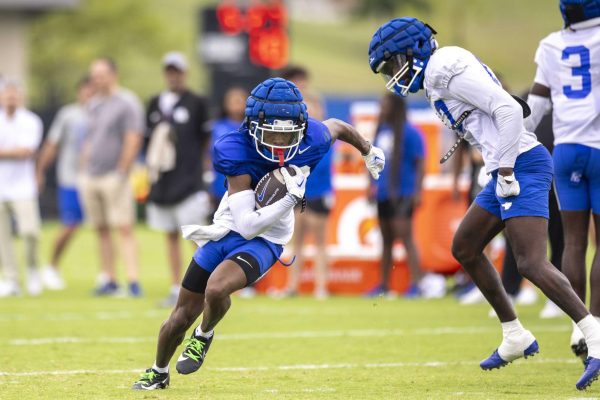 Wide Receiver Fred Farrier II avoids a defender during Kentucky Football’s media day on Saturday, Aug. 3, 2024, at Kroger Field in Lexington, Kentucky. Photo by Matthew Mueller | Photo Editor