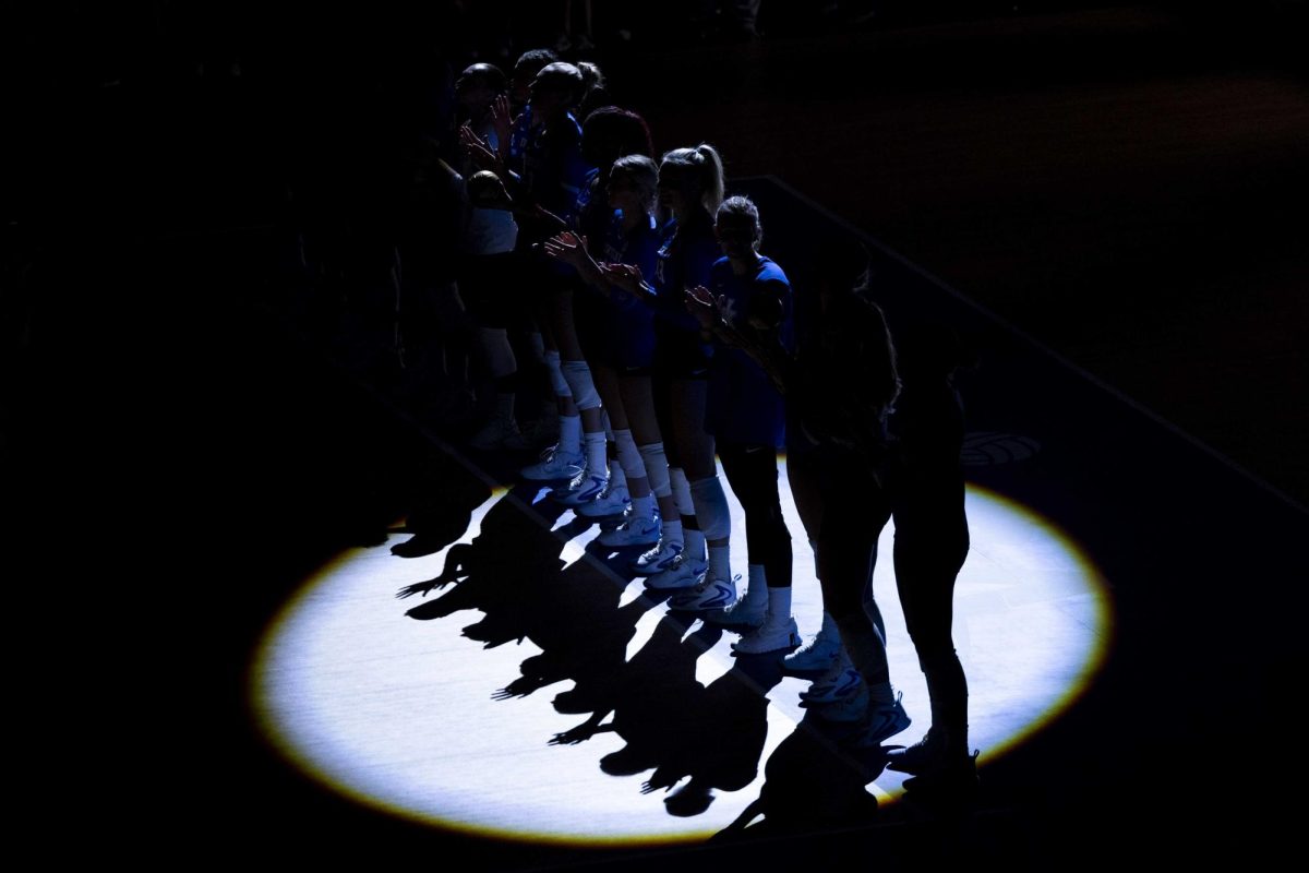 Kentucky Volleyball players stand and wait for the team’s opening entrance on Tuesday, Aug. 27, 2024, at the KFC Yum Center in Louisville, Kentucky. Kentucky lost to Nebraska 3-1. Photo by Matthew Mueller | Photo editor