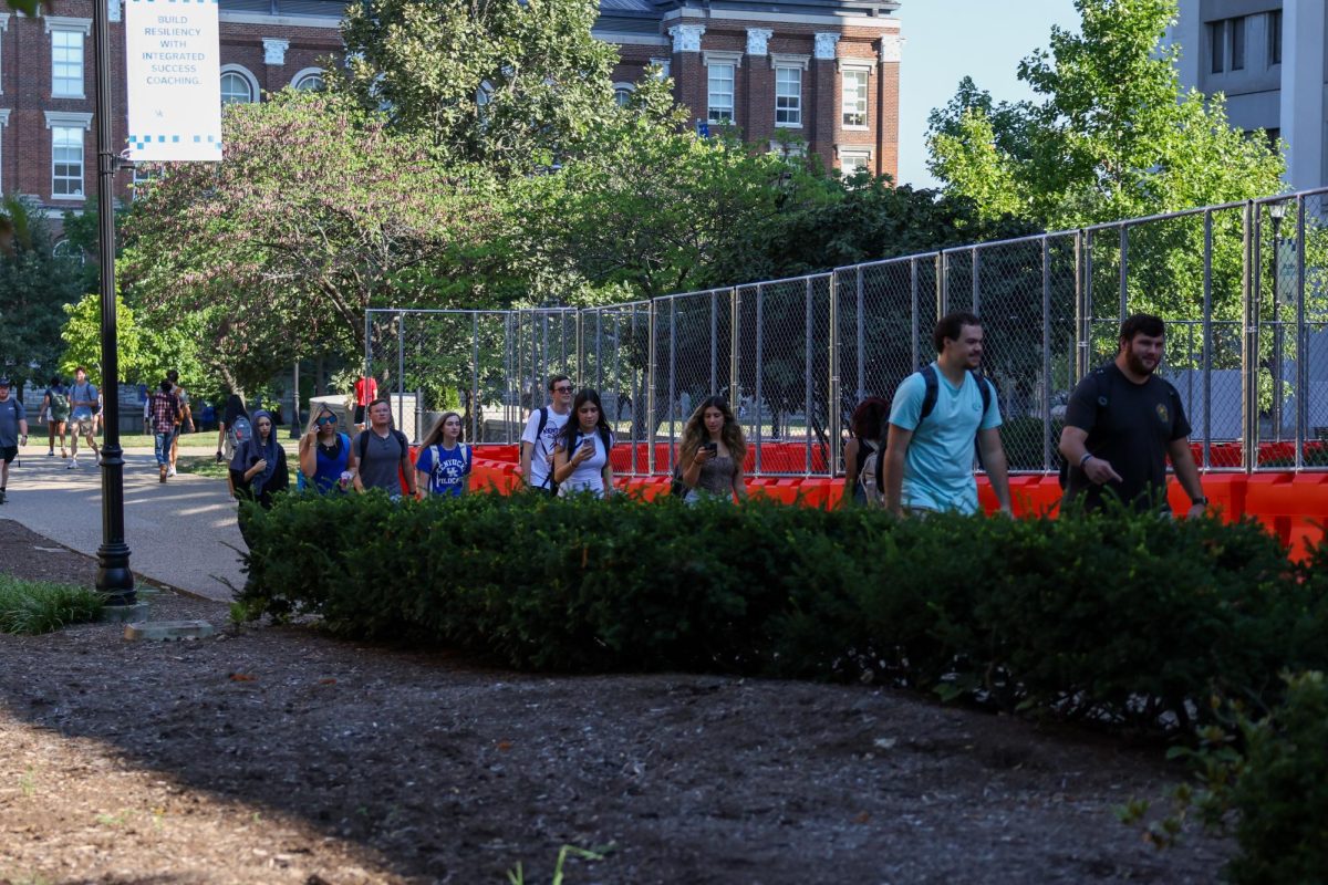 Kentucky students walk past construction on White Hall Classroom Building for the first day of classes on Monday, Aug. 26, 2024, in Lexington Kentucky. Photo by Sydney Yonker | Staff