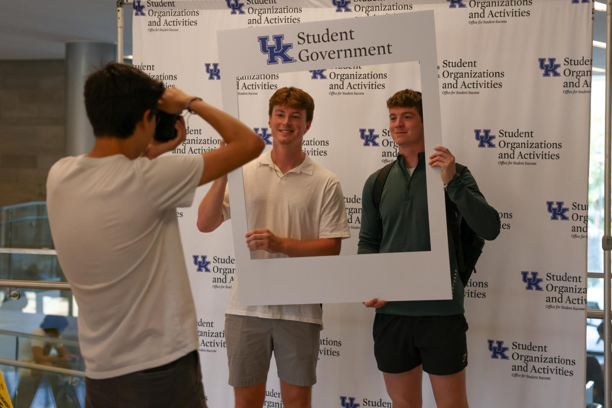 Kentucky students Dalton Bertram a senior who is a Clinical Leadership and Management major and Alex Davis a sophomore who is a finance major take a picture for the first day of classes on Monday, Aug. 26, 2024, in the Gatton Student Center in Lexington, Kentucky. Photo by Sydney Yonker | Staff