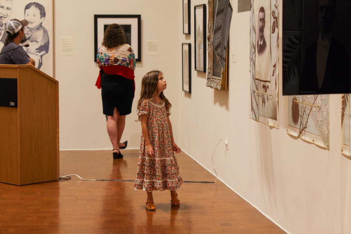 7 year old Marigold Ramsey admires the Family Dynamics exibit at the Singletary Center in Lexington, Kentucky, on Friday, Aug. 30, 2024. Photo by Sydney Yonker | Staff