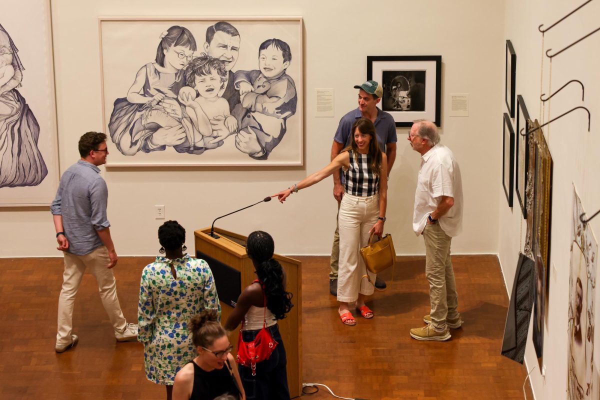 Members of the community attend the new Family Dynamics exhibit at the Singletary Center in Lexington, Kentucky, on Friday, Aug. 30, 2024. Photo by Sydney Yonker | Staff