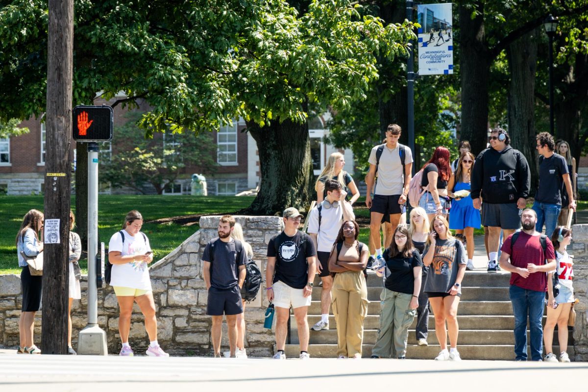 Students wait to cross the street on the first day of classes Monday, Aug. 26, 2024, at the University of Kentucky in Lexington, Kentucky. Photo by Samuel Colmar | Staff