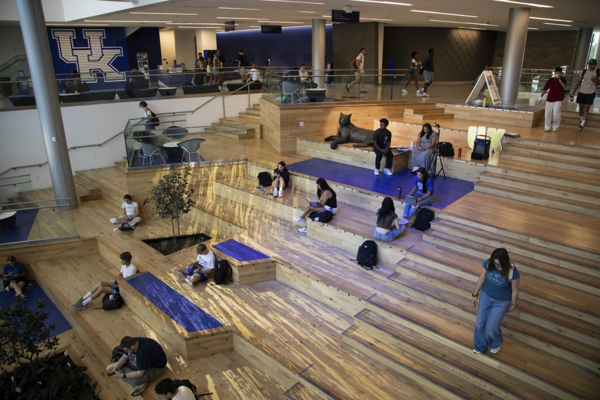 On the first day of classes, students congregate on the social staircase on Monday, Aug. 26, 2024, in Lexington, Kentucky. Photo by Christian Kantosky | Staff