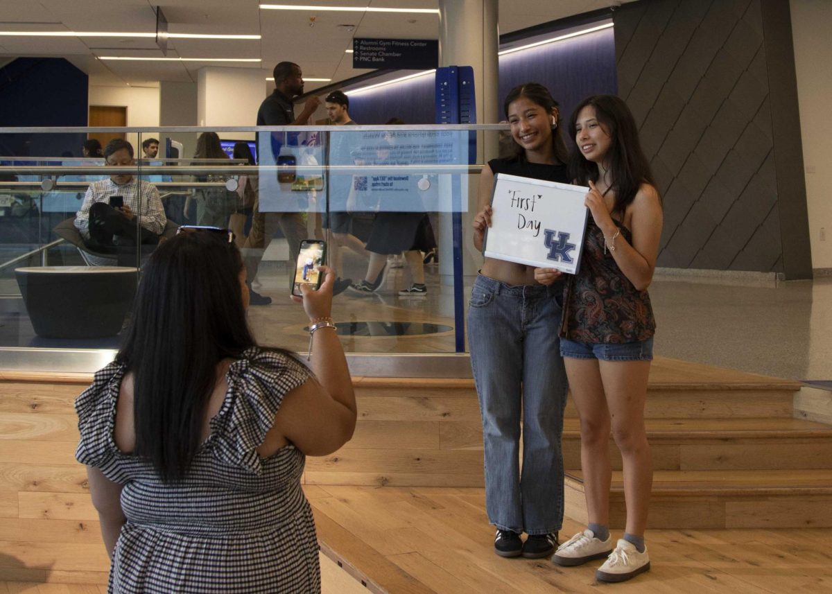 Amy and Monserrat Moctezuma Perez (Left to right), a Political Science Sophomore and a Media Arts & Studies Freshman respectively, pose to have their picture taken in the Gatton Student Center for the first day of classes on Monday, Aug. 26, 2024, in Lexington, Kentucky. Photo by Christian Kantosky | Staff