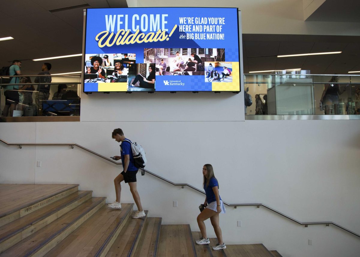 Students walk up the social staircase in the Gatton Student Center on the first day of classes on Monday, Aug. 26, 2024, in Lexington, Kentucky. Photo by Christian Kantosky | Staff