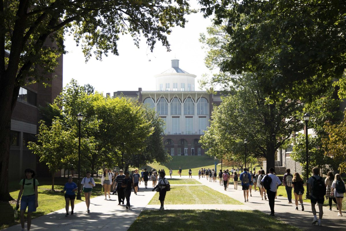 Students walk to class along the path on the backside of William T. Young Library on Monday, Aug. 26, 2024, in Lexington, Kentucky. Photo by Christian Kantosky | Staff