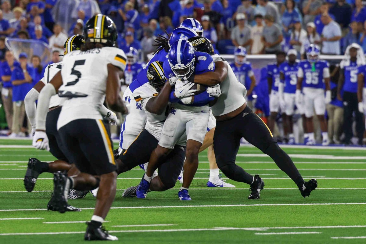 Kentucky running back Demi Sumo-Karngbaye fights through a tackle during the Kentucky vs Southern Miss football game on Saturday, Aug. 31, 2024, at Kroger Field in Lexington, Kentucky. Kentucky won 31-0. Photo by Sydney Yonker | Staff