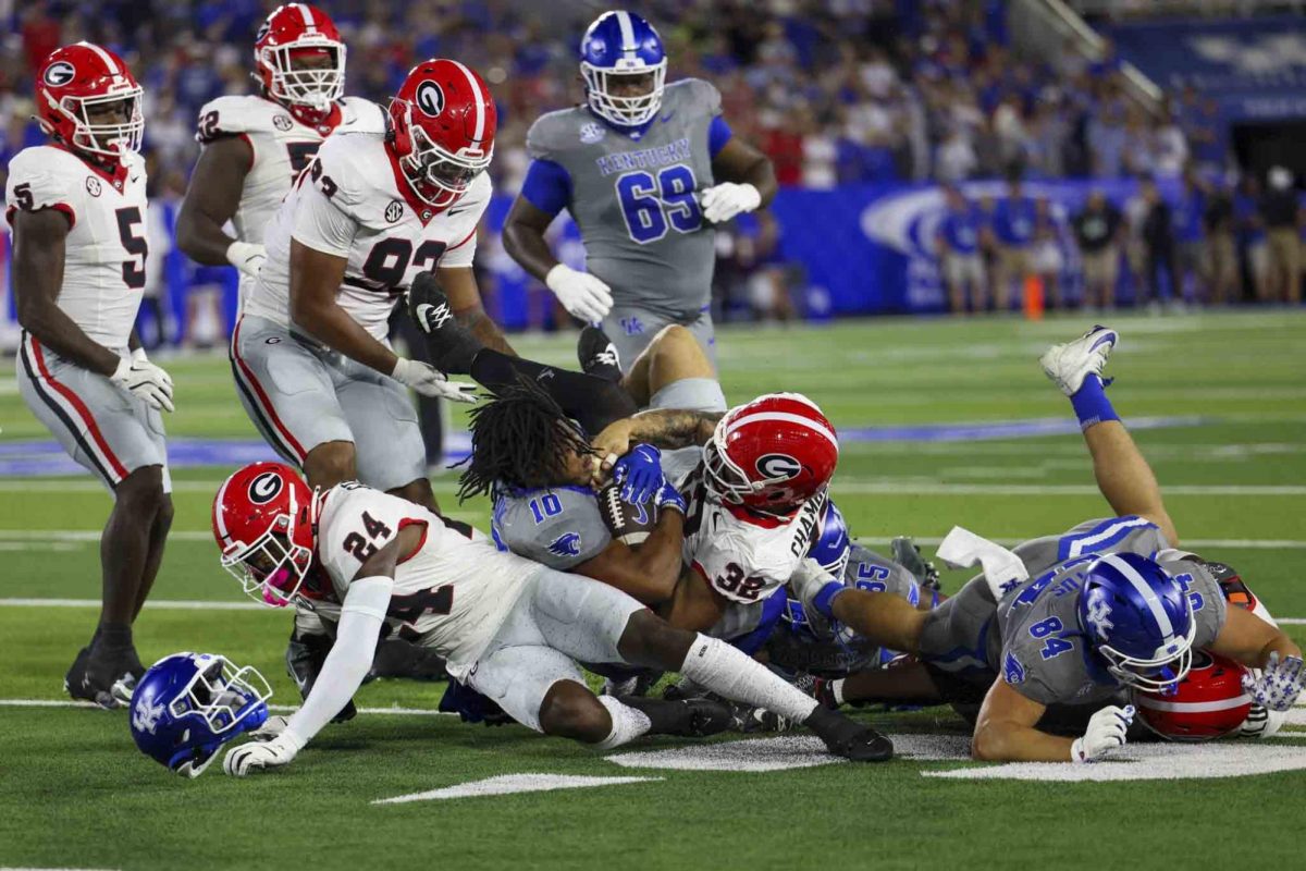 Kentucky Wildcats running back Jamarion Wilcox (10) loses his helmet while being tackled during the game between Kentucky and Georgia on Saturday, Sept. 14, 2024, at Kroger Field in Lexington, Kentucky. Kentucky lost to Georgia 13-12. Photo by Sydney Yonker | Staff