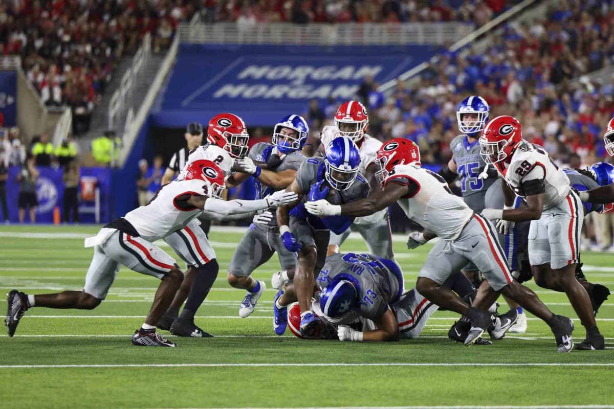 Kentucky Wildcats running back Demie Sumo-Karngbaye (0) runs through the block during the game between Kentucky and Georgia on Saturday, Sept. 14, 2024, at Kroger Field in Lexington, Kentucky. Kentucky lost to Georgia 13-12. Photo by Sydney Yonker | Staff