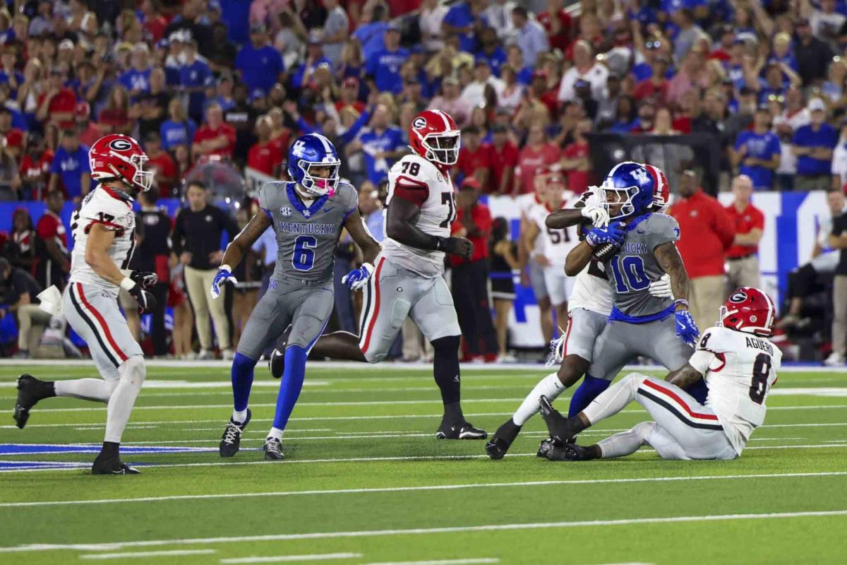 Kentucky Wildcats running back Jamarion Wilcox (10) fights through a tackle during the game between Kentucky and Georgia on Saturday, Sept. 14, 2024, at Kroger Field in Lexington, Kentucky. Kentucky lost to Georgia 13-12. Photo by Sydney Yonker | Staff