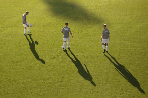 Players warms up for the Kentucky Men's Soccer game vs. Virginia Tech at the Wendell and Vickie Bell Soccer Complex on Monday, Sep. 2, 2024, in Lexington, Kentucky. The team wears "All in for Miller" warmup gear in support of all whom have been affected by Pediatric Cancer. Photo by Christian Kantosky | Staff