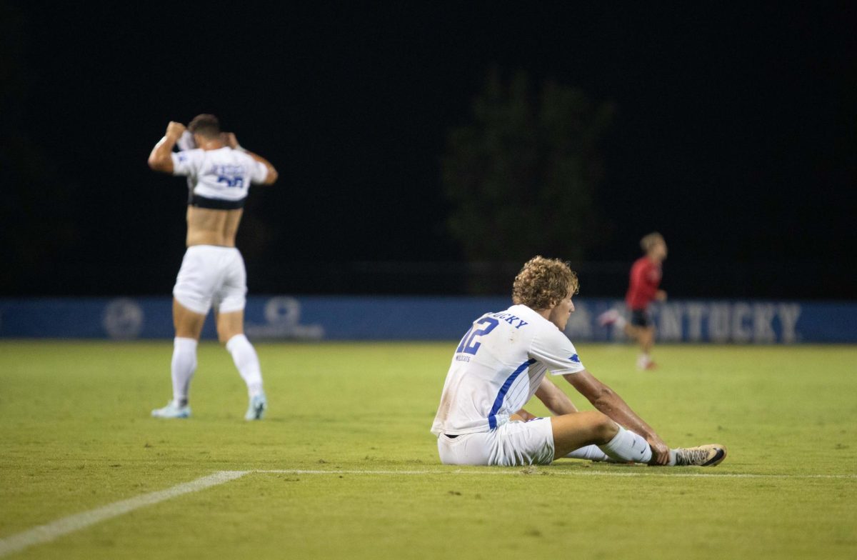 Forward, Logan Dorsey watches remorsefully as Wisconsin celebrates their win in the Kentucky vs #10 Wisconsin match on Friday, Sept. 6, 2024, at the Wendell and Vickie Bell Soccer Complex in Lexington, Kentucky. Kentucky lost 1-0. Photo by Christian Kantosky | Staff