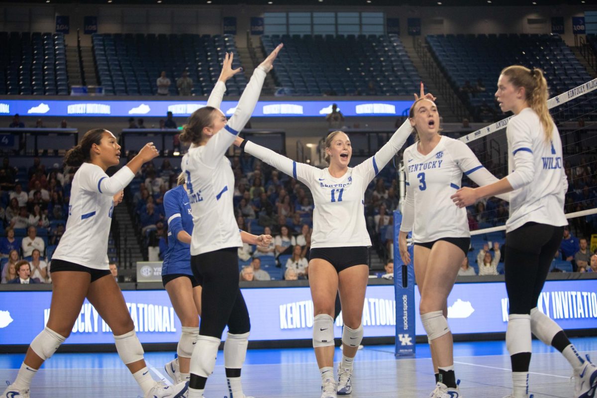 Brooklyn DeLeye celebrates with her teammates after they score a point in the second set of the Kentucky vs. James Madison match on Saturday, Sept. 7, 2024, at Historical Memorial Coliseum in Lexington, Kentucky. Kentucky won 3-0. Photo by Christian Kantosky | Staff