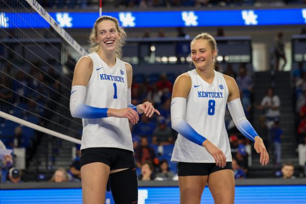 Kentucky outside hitter Megan Wilson and middle blocker Brooke Bultema laugh during the Kentucky vs Ball State Volleyball game Sunday, Sept. 8, 2024, at Memorial Colosseum in Lexington, Kentucky. Kentucky won 3-0. Photo by Sydney Yonker | Staff