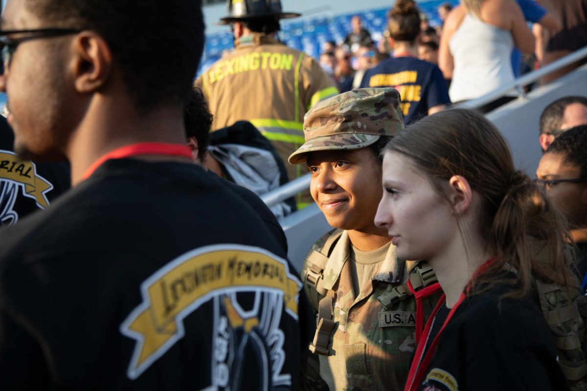 A soldier enters the stands for the 9/11 Memorial Stair Climb on Wednesday, Sept. 11, 2024, at Kroger Field in Lexington, Kentucky. Photo by Christian Kantosky | Staff