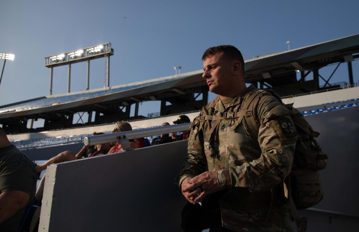 A soldier enters the stands for the 9/11 Memorial Stair Climb on Wednesday, Sept. 11, 2024, at Kroger Field in Lexington, Kentucky. Photo by Christian Kantosky | Staff