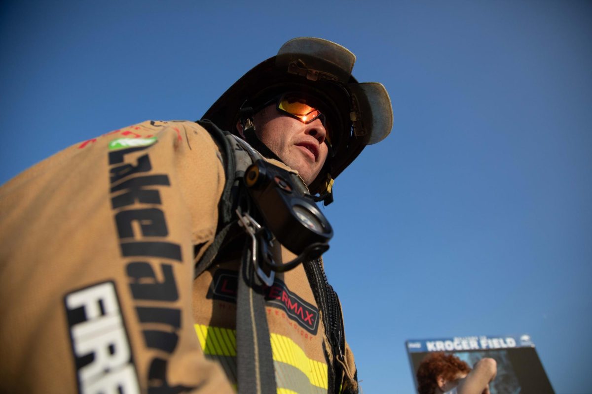 A firefighter enters the stands for the 9/11 Memorial Stair Climb on Wednesday, Sept. 11, 2024, at Kroger Field in Lexington, Kentucky. Photo by Christian Kantosky | Staff