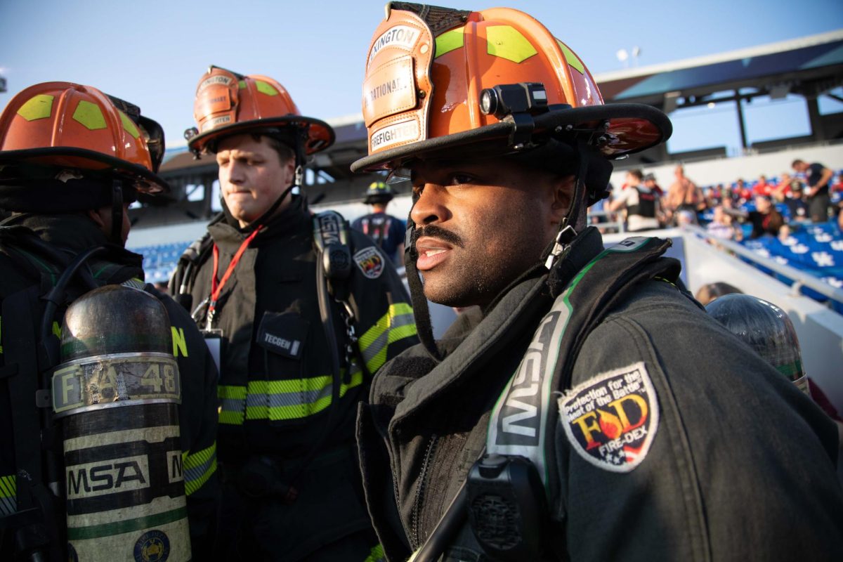 Firefighters enter the stands for the 9/11 Memorial Stair Climb on Wednesday, Sept. 11, 2024, at Kroger Field in Lexington, Kentucky. Photo by Christian Kantosky | Staff